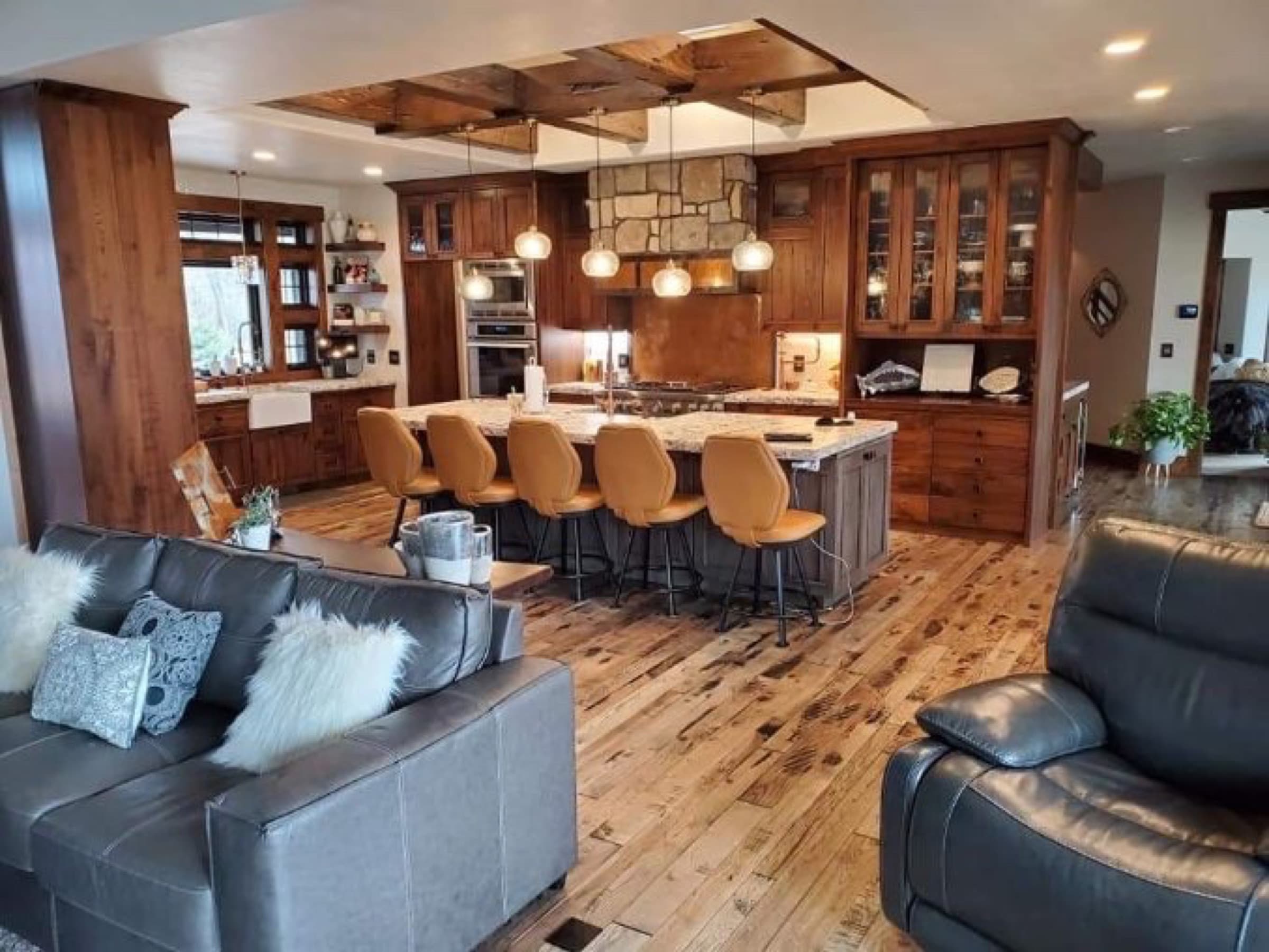 Knotty alder lodge kitchen with reclaimed beam ceiling by Peterson Cabinets & Trim